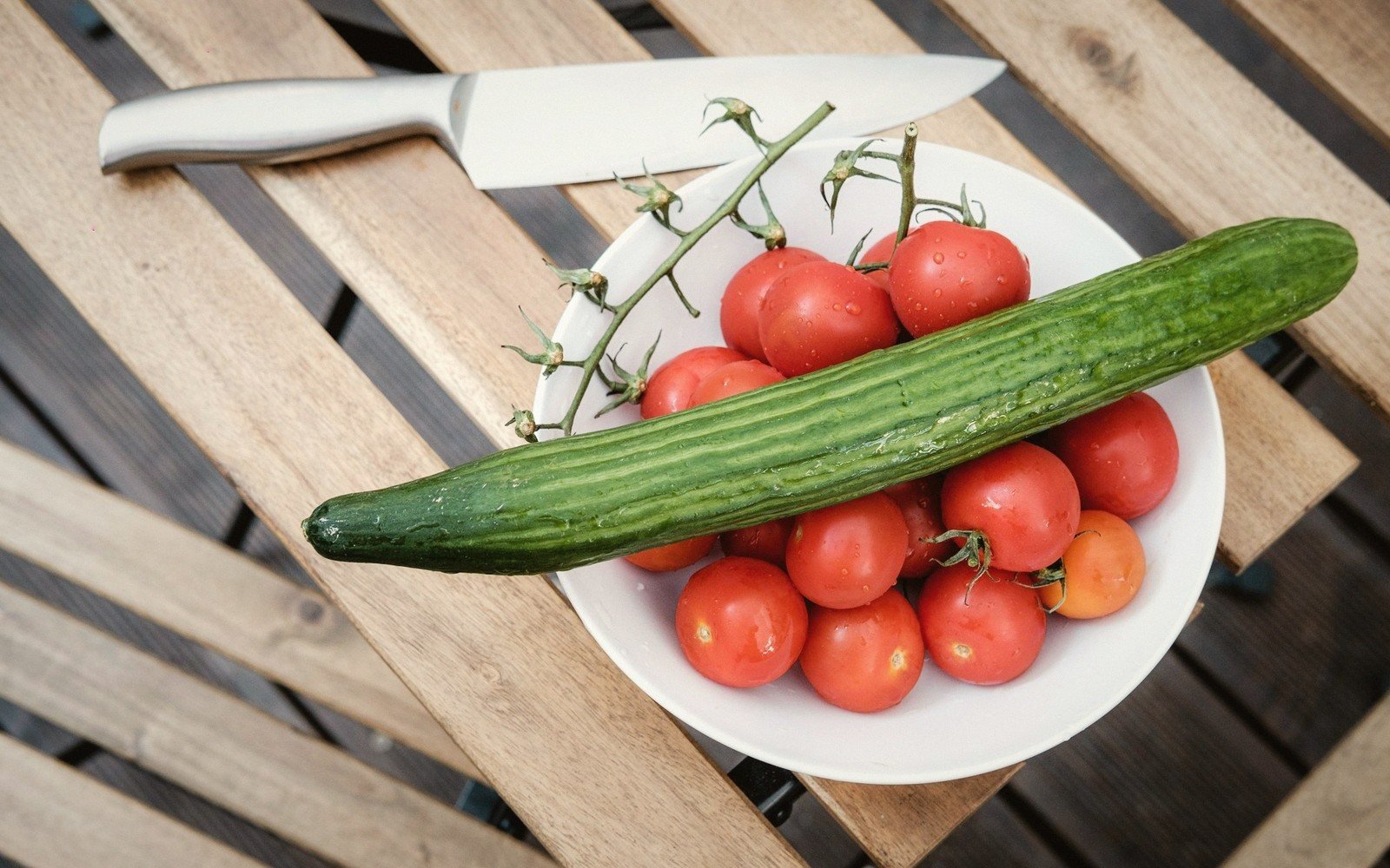 Sliced tomato and cucumber on a plate